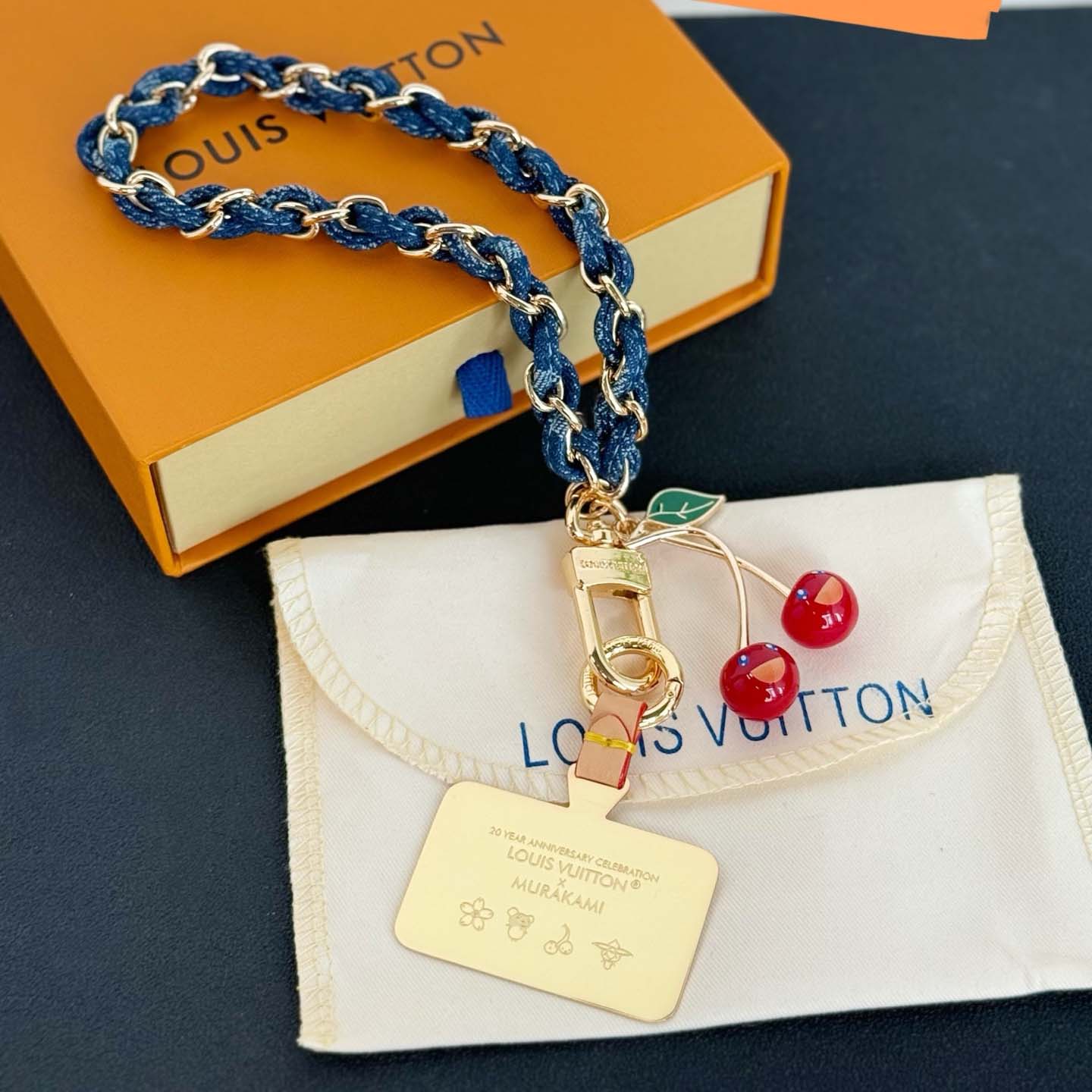 Louis Vuitton LV x TM Denim Cerise Phone Holder S00   M02623 - DesignerGu