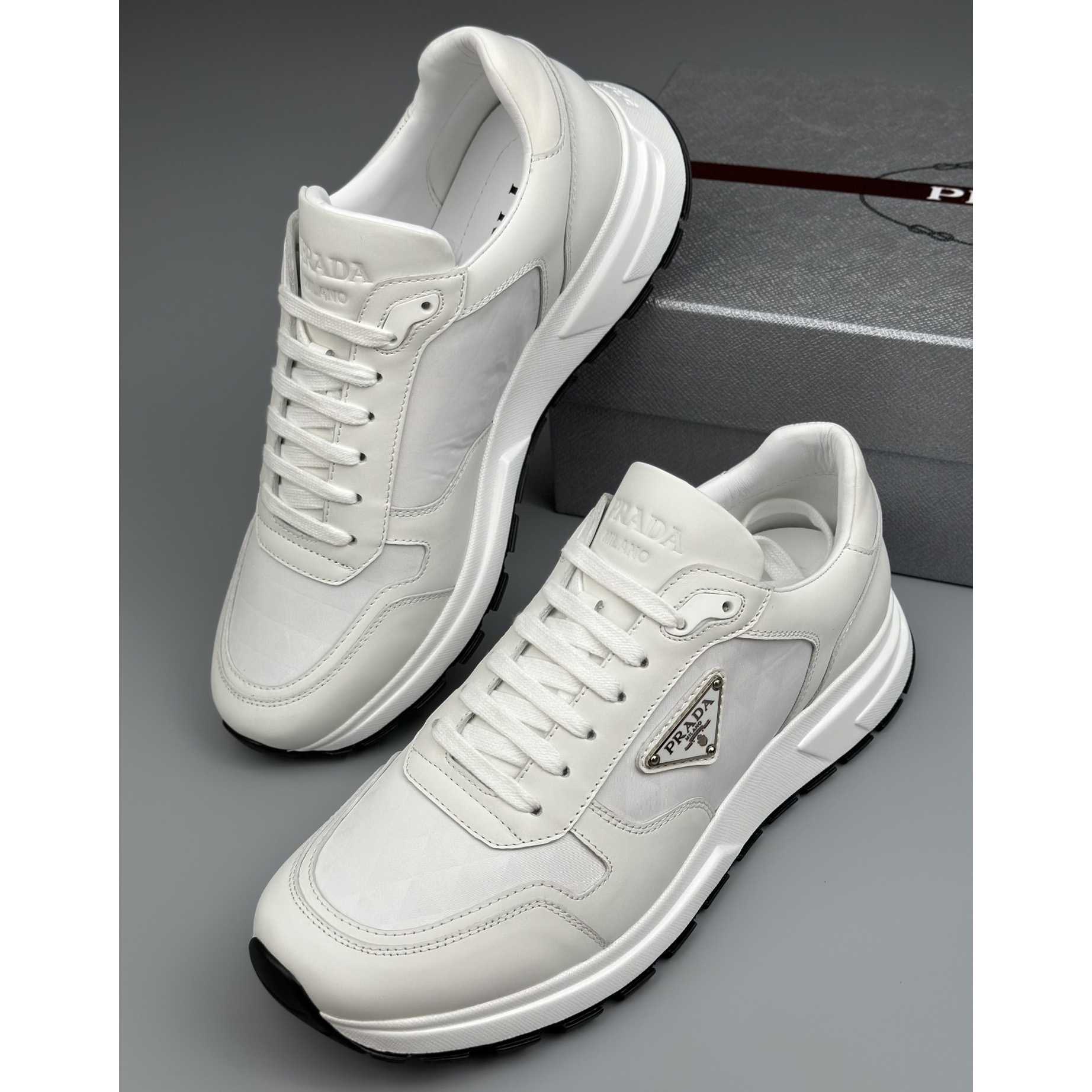 Prada Leather And Re-Nylon High-top Sneakers - 