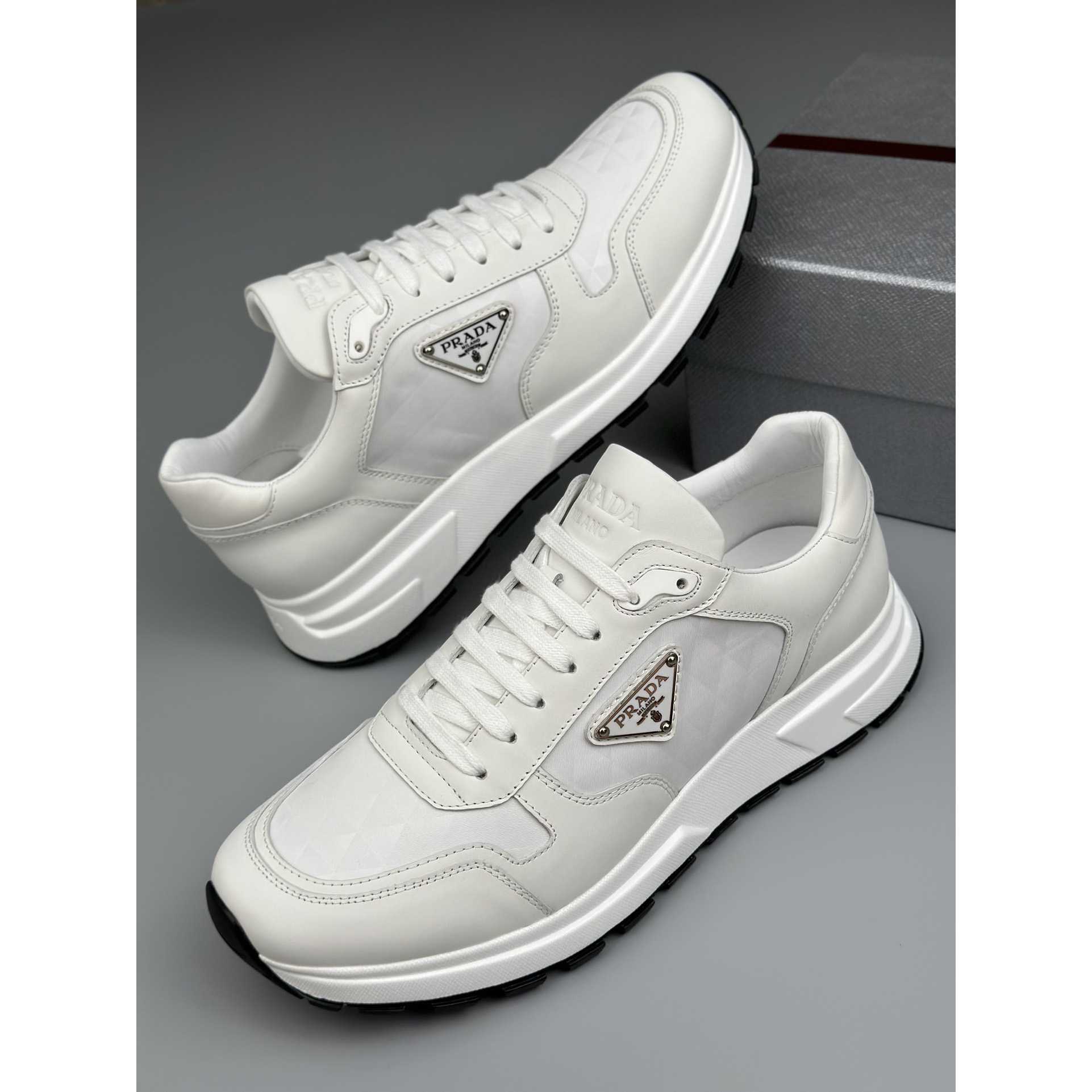 Prada Leather And Re-Nylon High-top Sneakers - 