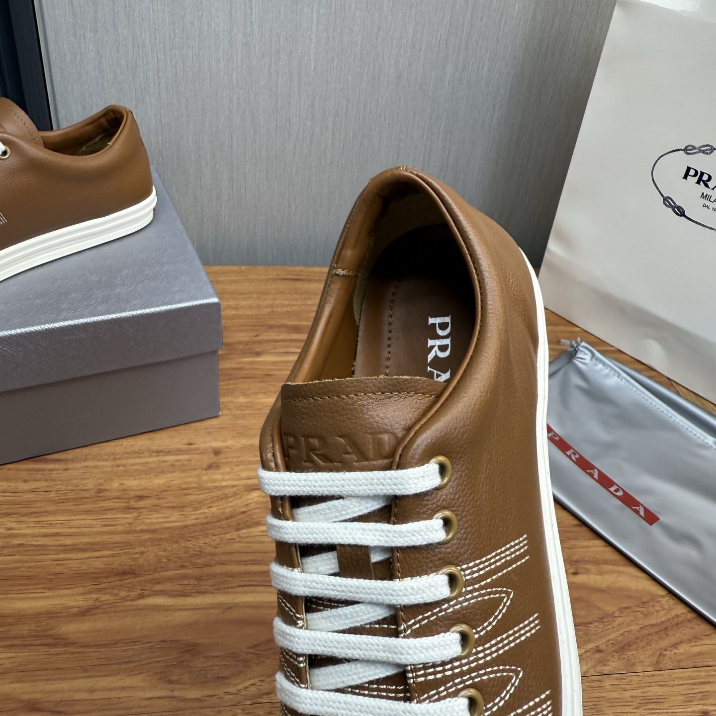 Prada Decorative-Stitching Leather Low-Top Sneakers - DesignerGu