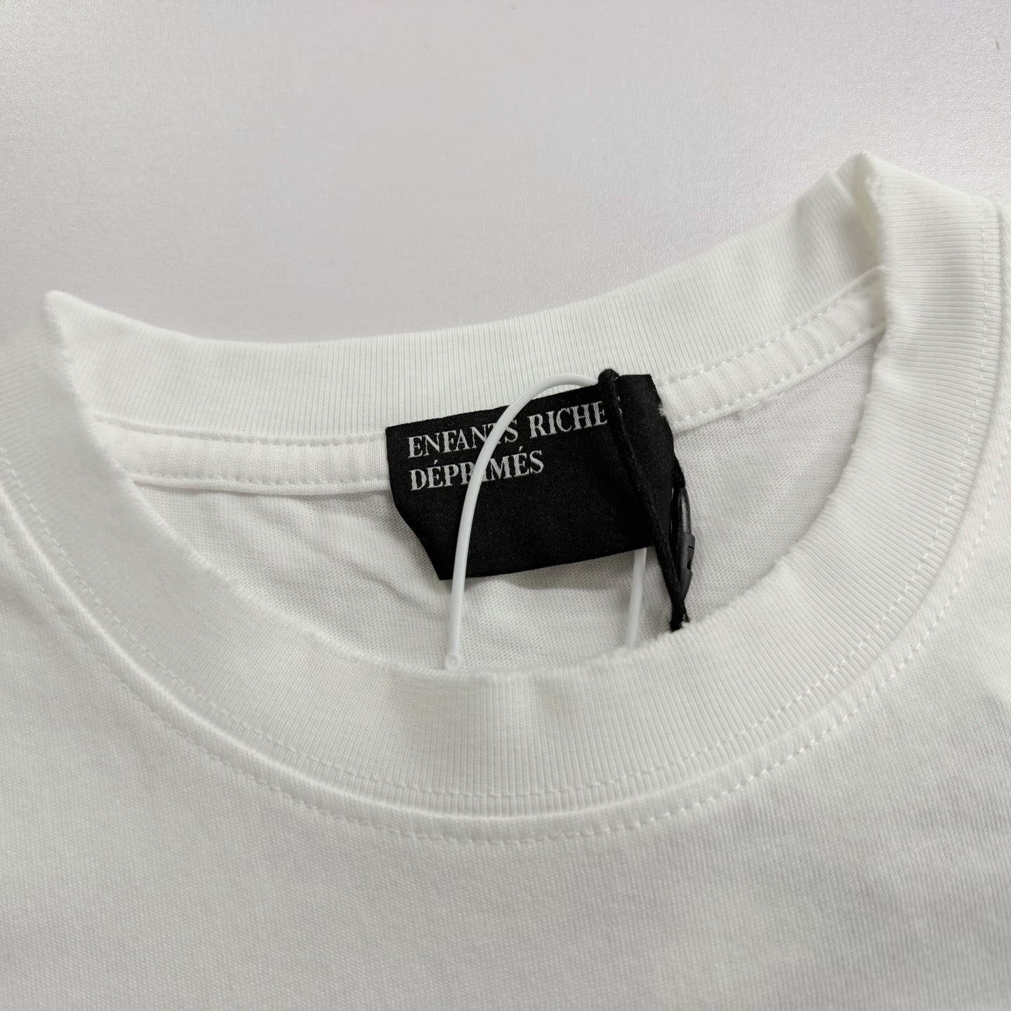 Enfants Riches Déprimés  Distressed Logo-Print Cotton-Jersey T-Shirt - White - DesignerGu